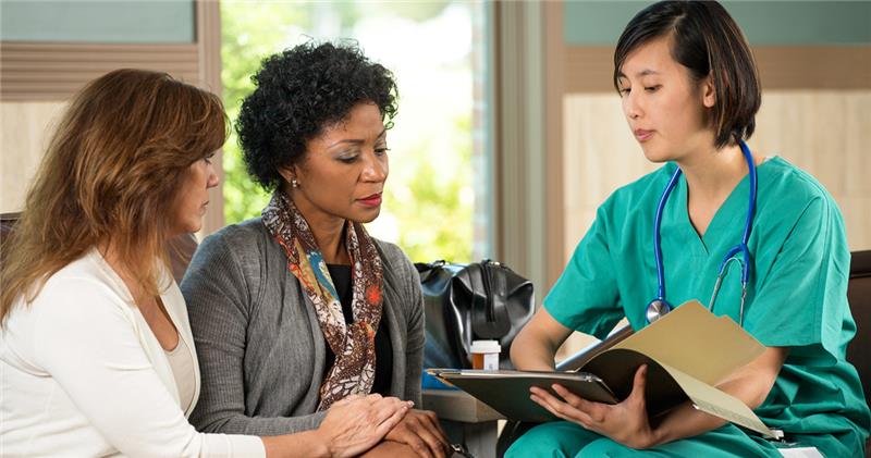 Doctor Engaging With Patient With Patient Health Information